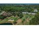 Overhead view of a golf course and condos at 3585 Torino Ln, Palm Harbor, FL 34683