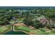 Aerial view of a golf course and surrounding area at 3585 Torino Ln, Palm Harbor, FL 34683