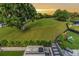 Backyard with a built-in grill, golf course view and playground at 3585 Torino Ln, Palm Harbor, FL 34683