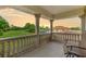 Balcony with decorative columns offering views of a golf course at 3585 Torino Ln, Palm Harbor, FL 34683