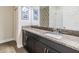 Bathroom with granite countertops, cabinets, and ample lighting at 3585 Torino Ln, Palm Harbor, FL 34683