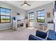 Bedroom with large windows, neutral walls, and a ceiling fan at 3585 Torino Ln, Palm Harbor, FL 34683