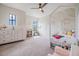 Bedroom featuring a canopy bed, white furnishings, and neutral decor at 3585 Torino Ln, Palm Harbor, FL 34683