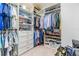 Walk-in closet with built-in shelving and hanging space for organization at 3585 Torino Ln, Palm Harbor, FL 34683