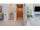 Interior view of an elevator with the living room and staircase visible at 3585 Torino Ln, Palm Harbor, FL 34683