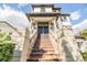Stairway leads to the double-door entrance of the home, framed by decorative columns at 3585 Torino Ln, Palm Harbor, FL 34683