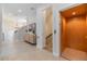 Hallway with an elevator and an open view into a living space at 3585 Torino Ln, Palm Harbor, FL 34683