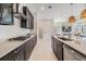 Modern kitchen featuring sleek countertops, and stainless steel appliances at 3585 Torino Ln, Palm Harbor, FL 34683