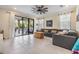 Spacious living room with sliding glass doors to the patio bringing the outdoors in at 3585 Torino Ln, Palm Harbor, FL 34683