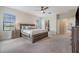 Bright main bedroom offers great natural light, carpet, and access to walk-in closet at 3585 Torino Ln, Palm Harbor, FL 34683