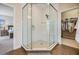 Spacious tiled shower with glass enclosure, bench, and neutral finishes at 3585 Torino Ln, Palm Harbor, FL 34683
