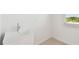 Modern laundry room with a large utility sink, window, and stylish tile flooring, perfect for convenience and functionality at 37202 Clinch Cir, Zephyrhills, FL 33540