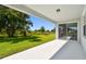 Spacious patio area with views of the backyard, creating an ideal outdoor living space for relaxation at 37202 Clinch Cir, Zephyrhills, FL 33540