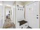 Home entryway boasts a custom hall tree bench and coat rack, providing stylish storage by the front door at 3753 Hollow Oak Pl, Land O Lakes, FL 34639