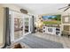 Bright living room with sliding glass doors and a feature wall with a large TV at 3753 Hollow Oak Pl, Land O Lakes, FL 34639