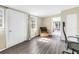 An office with a chair, window, and view to an adjacent room, and the sunroom beyond at 3753 Hollow Oak Pl, Land O Lakes, FL 34639