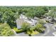 An aerial view showcases a modern home with lush greenery and mature trees at 4002 Cypress Ct # 4002, Tampa, FL 33618