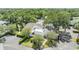 An aerial view features a modern home surrounded by mature landscaping and lush greenery at 4002 Cypress Ct # 4002, Tampa, FL 33618