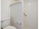 Bathroom features a white tiled walk-in shower and a standard toilet with chrome fixtures at 4002 Cypress Ct # 4002, Tampa, FL 33618