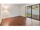 Bedroom features hardwood floors and sliding glass doors leading to a patio area at 4002 Cypress Ct # 4002, Tampa, FL 33618