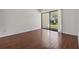 Bedroom showcases hardwood floors and sliding glass doors to the outside at 4002 Cypress Ct # 4002, Tampa, FL 33618