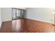 Cozy bedroom with wood floors and a sliding glass door to the outside at 4002 Cypress Ct # 4002, Tampa, FL 33618