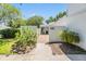 Inviting entrance to home with brick walkway, lush landscaping, and clear signage for 4002 at 4002 Cypress Ct # 4002, Tampa, FL 33618