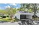 Charming home featuring a two-car carport and well-maintained front yard with mature trees and green grass at 4002 Cypress Ct # 4002, Tampa, FL 33618