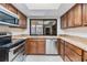 Bright kitchen with stainless appliances, granite countertops, and a garden window at 4002 Cypress Ct # 4002, Tampa, FL 33618
