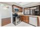 Modern kitchen featuring stainless steel appliances, granite countertops, and ample cabinet space at 4002 Cypress Ct # 4002, Tampa, FL 33618