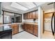 Spacious kitchen includes stainless appliances, granite countertops and tile flooring at 4002 Cypress Ct # 4002, Tampa, FL 33618