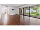 Bright living room with wood-look tile floors, ceiling fan and sliding glass doors to a private courtyard at 4002 Cypress Ct # 4002, Tampa, FL 33618