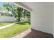 Outdoor patio with brick floors and view of grassy lawn, trees, and surrounding houses at 4002 Cypress Ct # 4002, Tampa, FL 33618