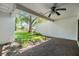 Brick patio with ceiling fan showing a view of lawn and surrounding houses at 4002 Cypress Ct # 4002, Tampa, FL 33618