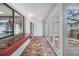 Enclosed patio with brick floors, pass through to the kitchen, and access to other patios at 4002 Cypress Ct # 4002, Tampa, FL 33618
