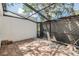 Brick-paved patio with an overhead metal frame, adjacent gravel section, and privacy fence at 4002 Cypress Ct # 4002, Tampa, FL 33618