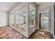 Outdoor patio features brick floors and sliding glass doors leading to other areas at 4002 Cypress Ct # 4002, Tampa, FL 33618