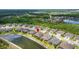 A beautiful house on a pond in a neatly planned neighborhood from an aerial perspective at 4220 Barletta Ct, Wesley Chapel, FL 33543