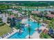 Stunning aerial view of the community pool, surrounded by lush greenery and resort-style amenities at 4220 Barletta Ct, Wesley Chapel, FL 33543