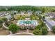 The aerial view showcases a community pool surrounded by lush landscaping, offering a luxurious and relaxing retreat at 4220 Barletta Ct, Wesley Chapel, FL 33543