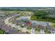 Aerial view of a house with a scenic pond in a beautiful neighborhood at 4220 Barletta Ct, Wesley Chapel, FL 33543