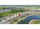 Aerial view showcases the house located by the pond in a Gathering-friendly neighborhood at 4220 Barletta Ct, Wesley Chapel, FL 33543