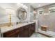 Beautiful bathroom with custom cabinets, granite countertops, and a tiled shower at 4220 Barletta Ct, Wesley Chapel, FL 33543