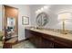 Stylish bathroom featuring custom wood cabinets and luxury finishes at 4220 Barletta Ct, Wesley Chapel, FL 33543