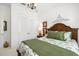 Comfortable bedroom with a decorative headboard, plantation shutters, and ample closet space at 4220 Barletta Ct, Wesley Chapel, FL 33543