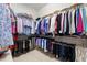 Walk-in closet with ample clothing storage space at 4220 Barletta Ct, Wesley Chapel, FL 33543