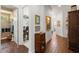 Hallway showcasing access to the bathroom, office, and other rooms, and decorative design at 4220 Barletta Ct, Wesley Chapel, FL 33543