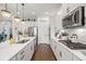 Well-equipped kitchen with stainless steel appliances, a central island, and ample counter space, perfect for cooking and entertaining at 4220 Barletta Ct, Wesley Chapel, FL 33543