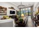 Comfortable living room with ample seating, a large TV, stylish decor, and access to an outdoor patio at 4220 Barletta Ct, Wesley Chapel, FL 33543