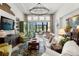 Cozy living room with a fireplace, comfortable seating, stylish decor, and an open layout at 4220 Barletta Ct, Wesley Chapel, FL 33543